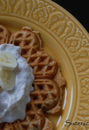 Peanut Butter-Chocolate Chip Waffles with Banana Cream on a yellow plate